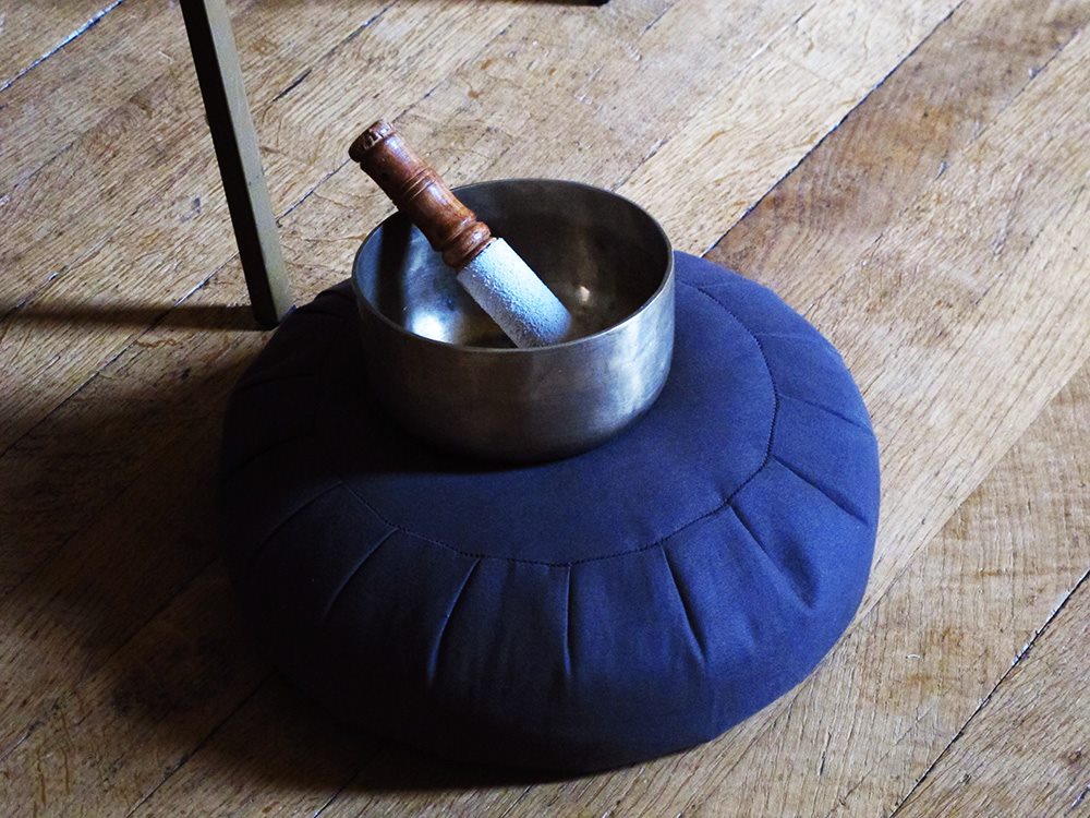 singing bowl on a meditation cushion